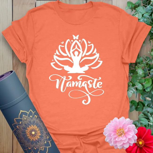 Vibrant orange yoga t-shirt showcasing sacred lotus and yogi design inspiring soulful grace and conscious living.