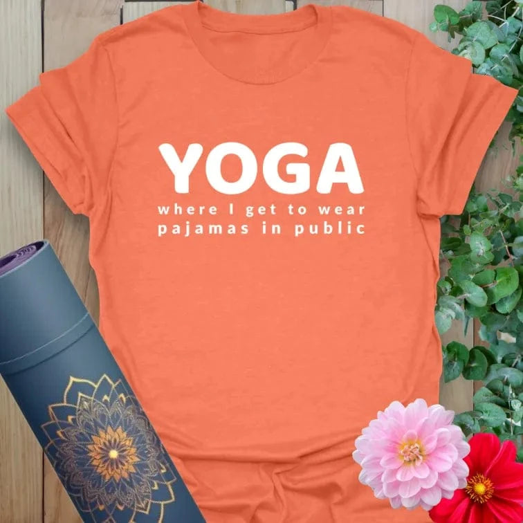 Vibrant orange yoga t-shirt showcasing fun, bold pajama quote blending yoga love with laid-back lifestyle humor.