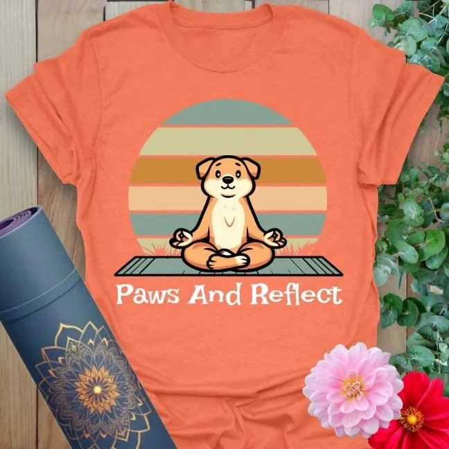 Vibrant orange yoga t-shirt showcasing serene pup on yoga mat with warm sunset for soulful, joyful mindfulness.