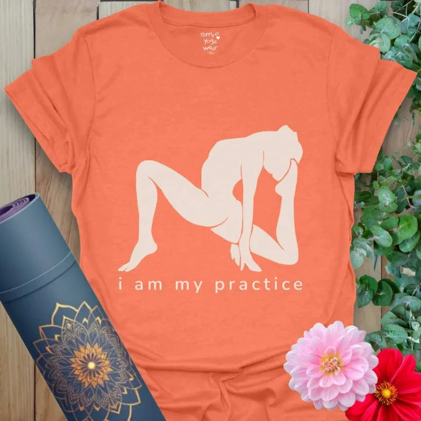 Heather Orange Practice T-Shirt with white yoga silhouette and "I am my practice" text. Soft yoga lifestyle tee.
