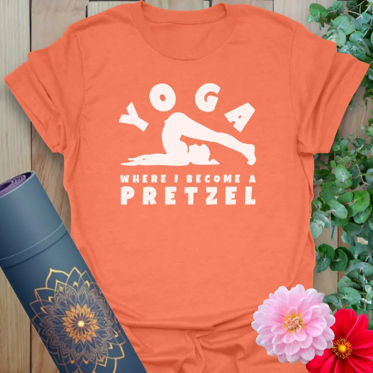 Vibrant orange yoga t-shirt showcasing funny yoga humor quote and flexible pose illustration for joyful, conscious movement.