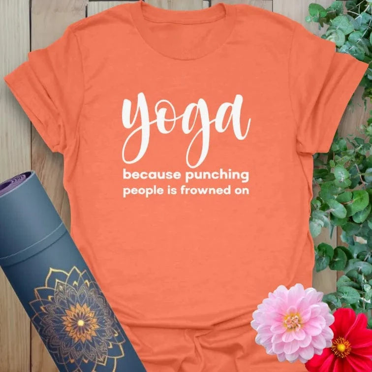 Vibrant orange yoga t-shirt showcasing cheeky yoga humor design inspiring playful mindfulness and conscious calm.