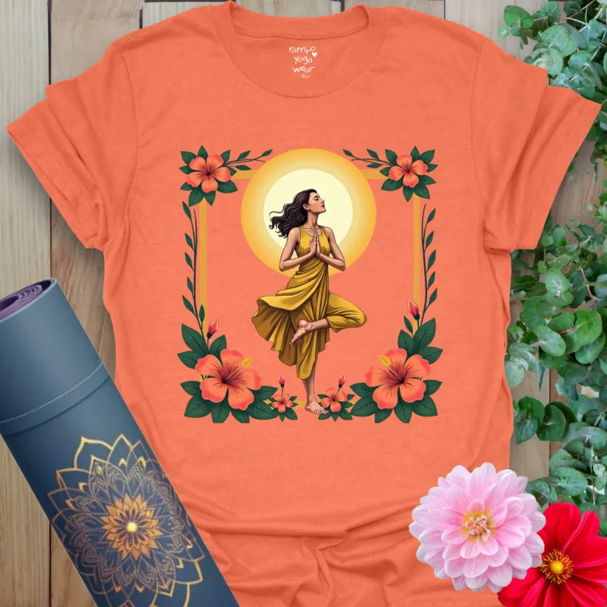 Vibrant orange yoga t-shirt showcasing yogi and golden sun design inspiring joyful, conscious movement and soulful strength.