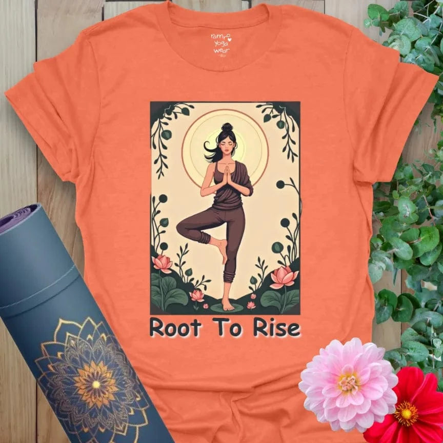 Vibrant orange t-shirt with colorful yoga art and motivational “Root to Rise” quote for conscious, empowered style.