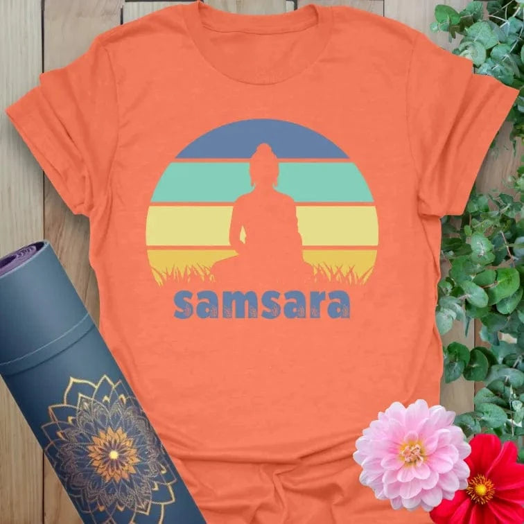 Vibrant orange yoga t-shirt showcasing soulful meditation scene and samsara theme for conscious living and mindful movement.