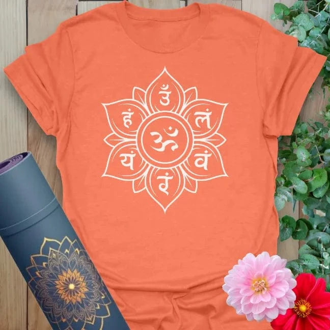 Vibrant orange yoga t-shirt showcasing sacred Sanskrit lotus mandala design inspiring mindful connection and conscious energy.