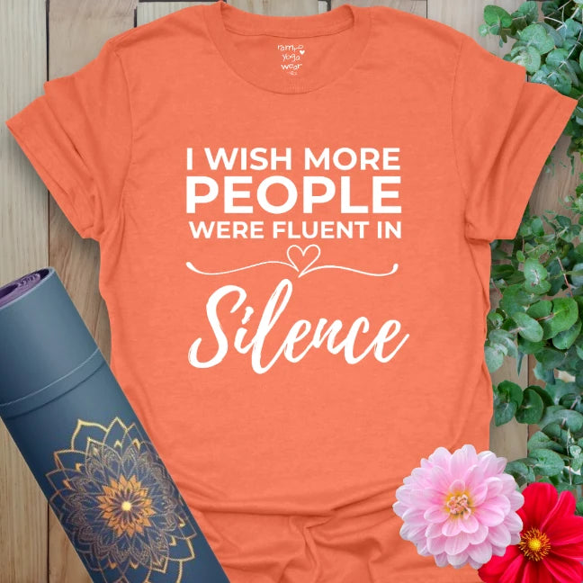 Vibrant orange yoga t-shirt showcasing humorous and soulful silence affirmation inspiring mindful communication and presence.