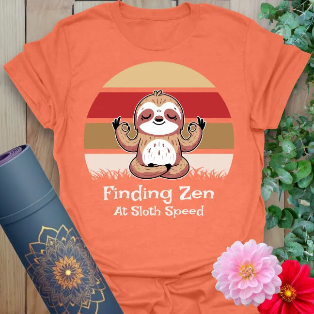 Vibrant orange yoga t-shirt showcasing chill sloth and mindfulness mantra inspiring conscious slow movement and joyful stillness.