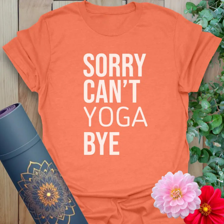 Vibrant orange yoga t-shirt with bold stacked text design expressing cheeky yoga love and humorous self-care vibes.