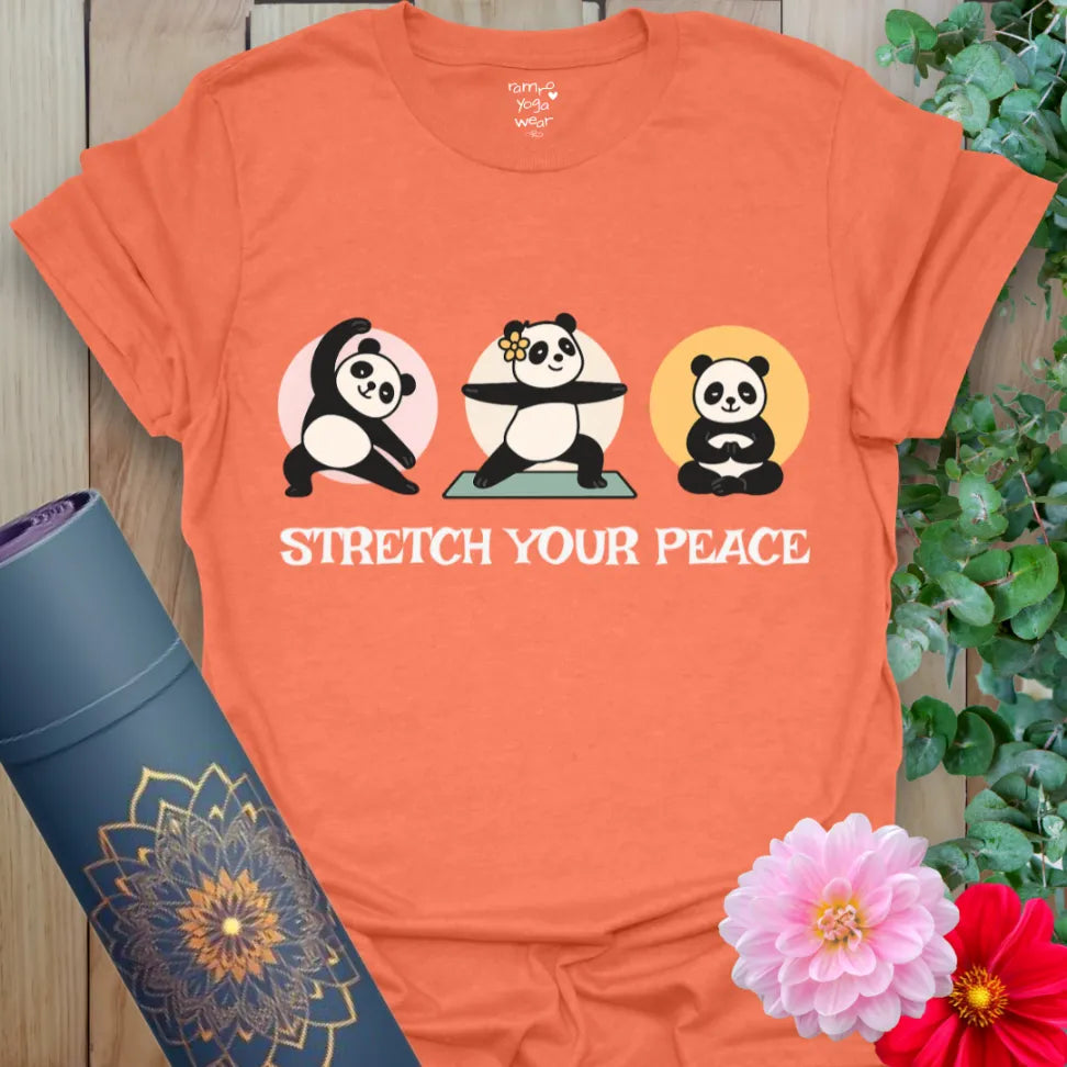 Vibrant orange t-shirt with pastel yoga panda design and funny peace message for light-hearted yoga wear.