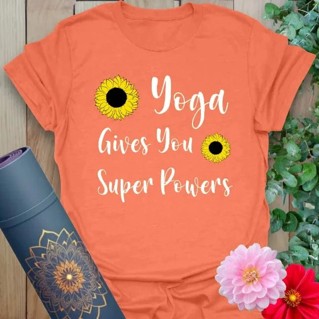 Vibrant orange tee featuring playful script and sunflower design to inspire strength and sunny energy in yoga practice.