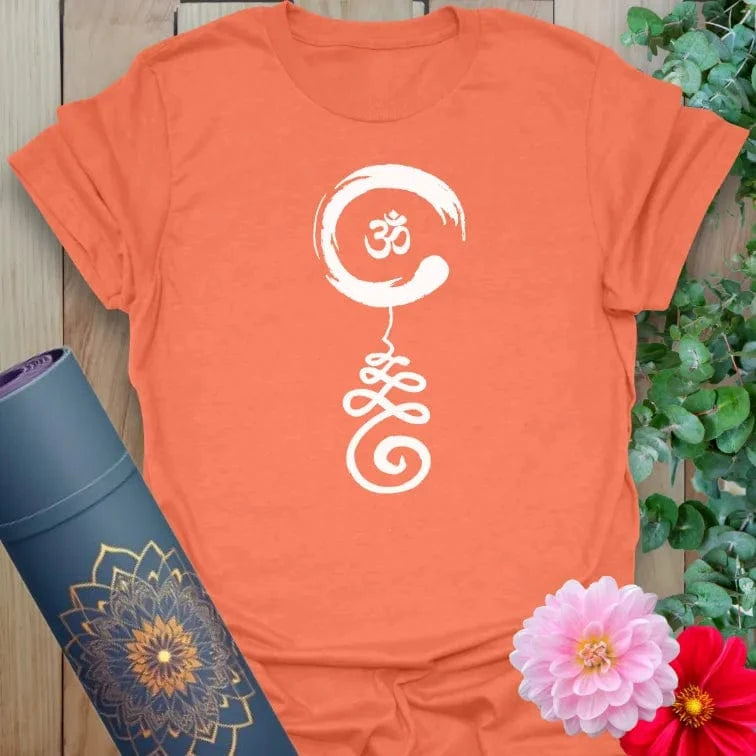 Vibrant orange t-shirt featuring sacred geometry symbol representing spiritual path and inner wisdom.