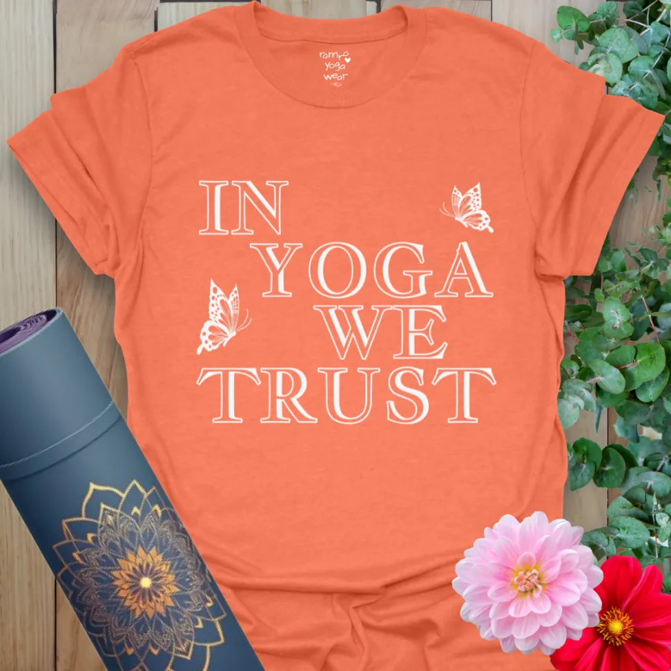 Vibrant orange t-shirt with bold spiritual mantra and butterfly accents, perfect for conscious lifestyle wear.