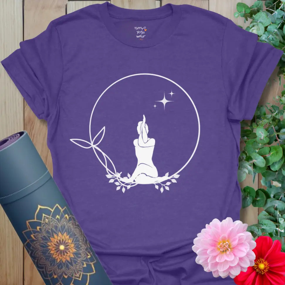 Heather Purple Solitude T-Shirt with white meditating silhouette inside a leafy circle and stars. Relaxed fit yoga top for mindfulness.
