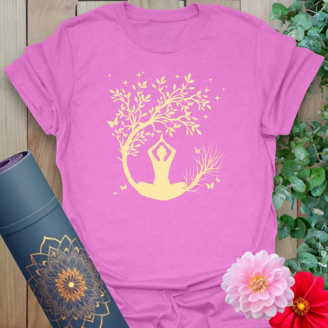 Radiant orchid-colored yoga tee showcasing meditative yogi silhouette and crescent moon-inspired nature art.