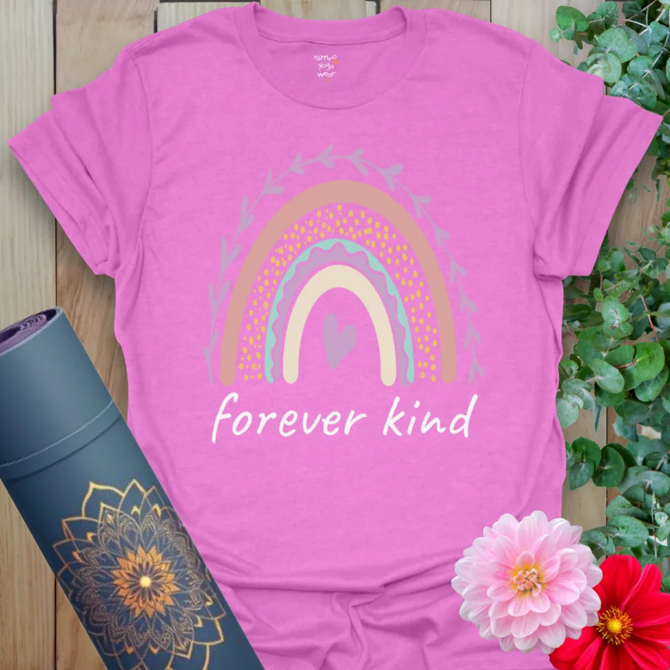 Radiant orchid-colored yoga tee with rainbow and heart design celebrating kindness, compassion, and positive energy.