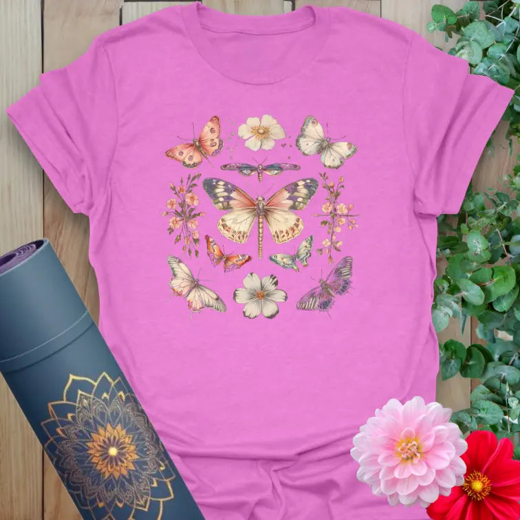 Radiant orchid-colored yoga tee with beautiful butterfly and flower circle celebrating transformation and natural beauty.