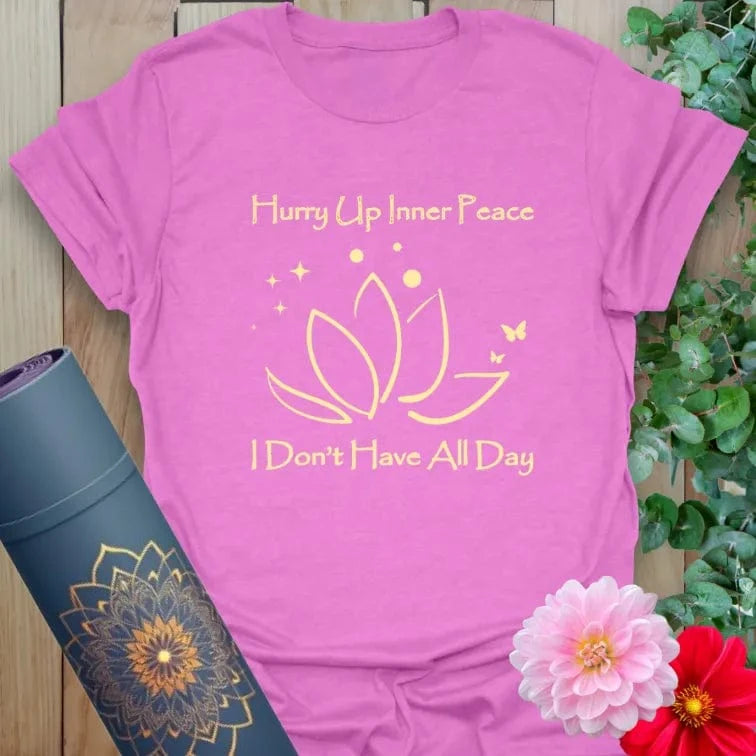 Radiant orchid-colored yoga tee with cheeky "Hurry Up Inner Peace" message inspiring soulful humor and mindfulness.
