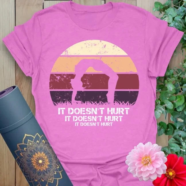 Radiant orchid-colored yoga tee with funny mindful movement quote and colorful retro sunset yogi artwork.