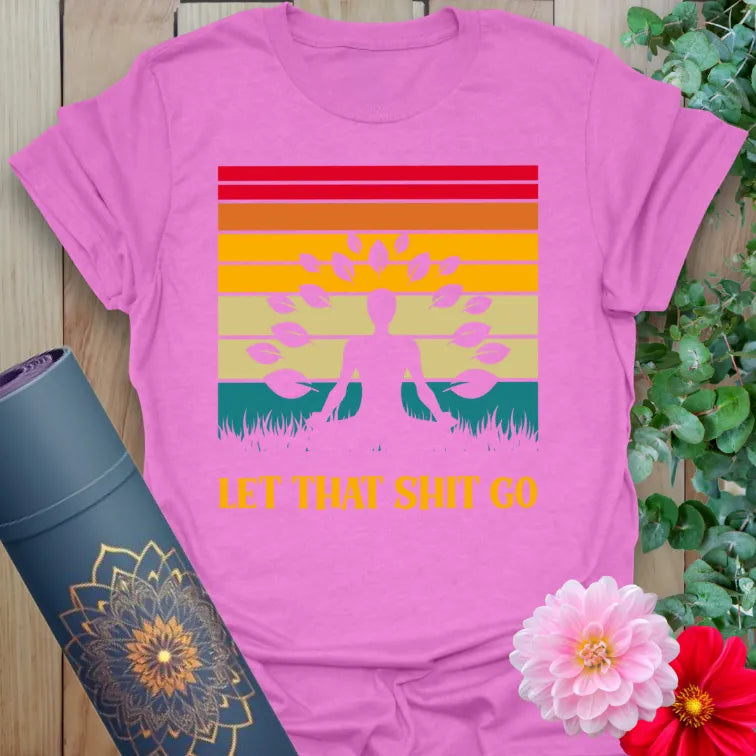 Radiant orchid-colored yoga tee featuring meditating figure, retro sunset, and funny mindful release message.