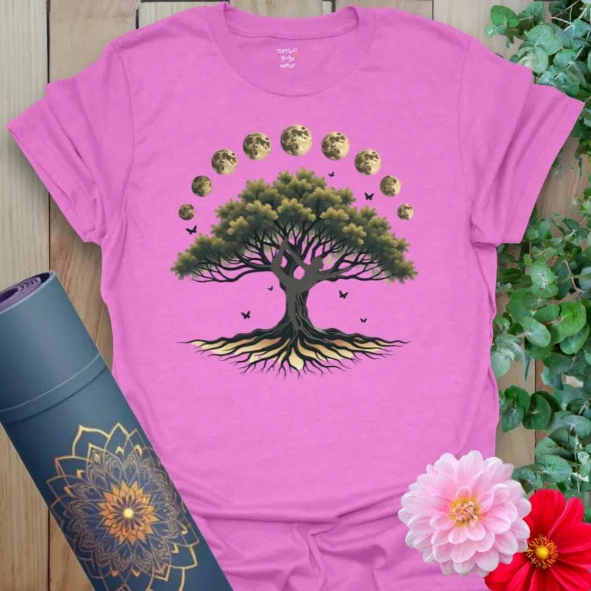 Radiant orchid-colored yoga tee with grounded tree and celestial moon phases celebrating spiritual growth and connection.