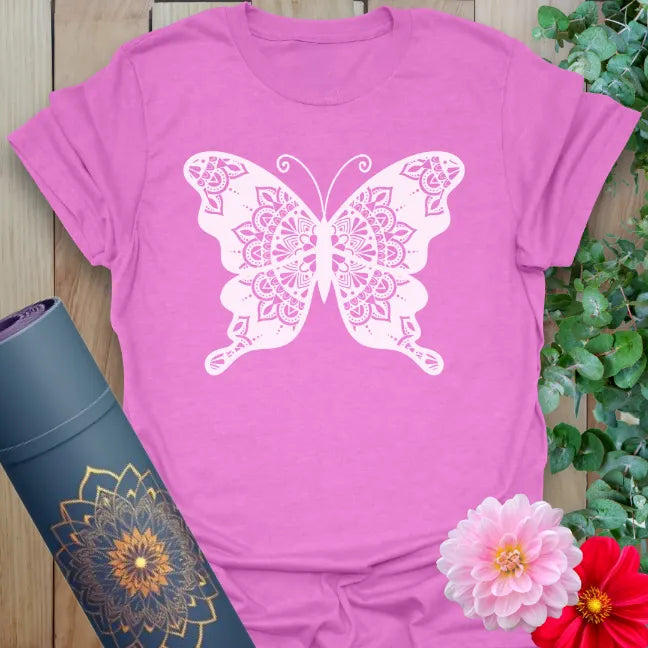 Radiant orchid-colored yoga tee with mandala butterfly design representing transformation, joy, and mindful movement.