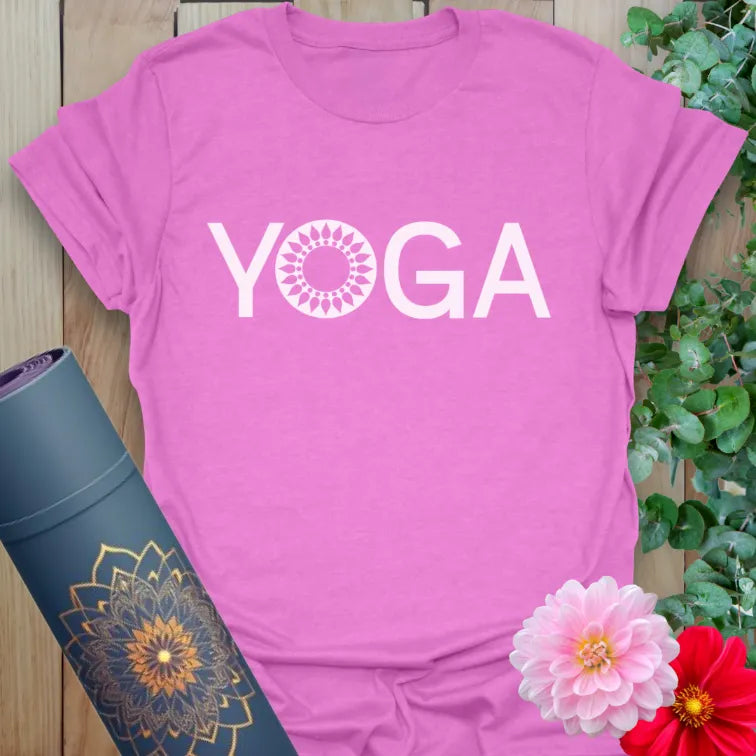 Radiant orchid-colored yoga tee with sacred “YOGA” design and symbolic mandala detail.