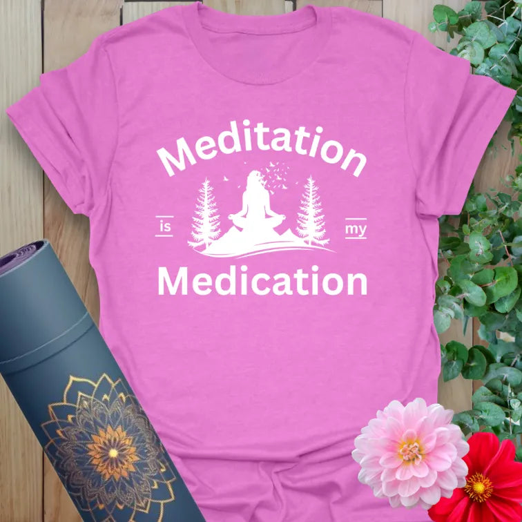 Radiant orchid-colored yoga tee with serene yogi and trees design celebrating meditation as soulful, natural medicine