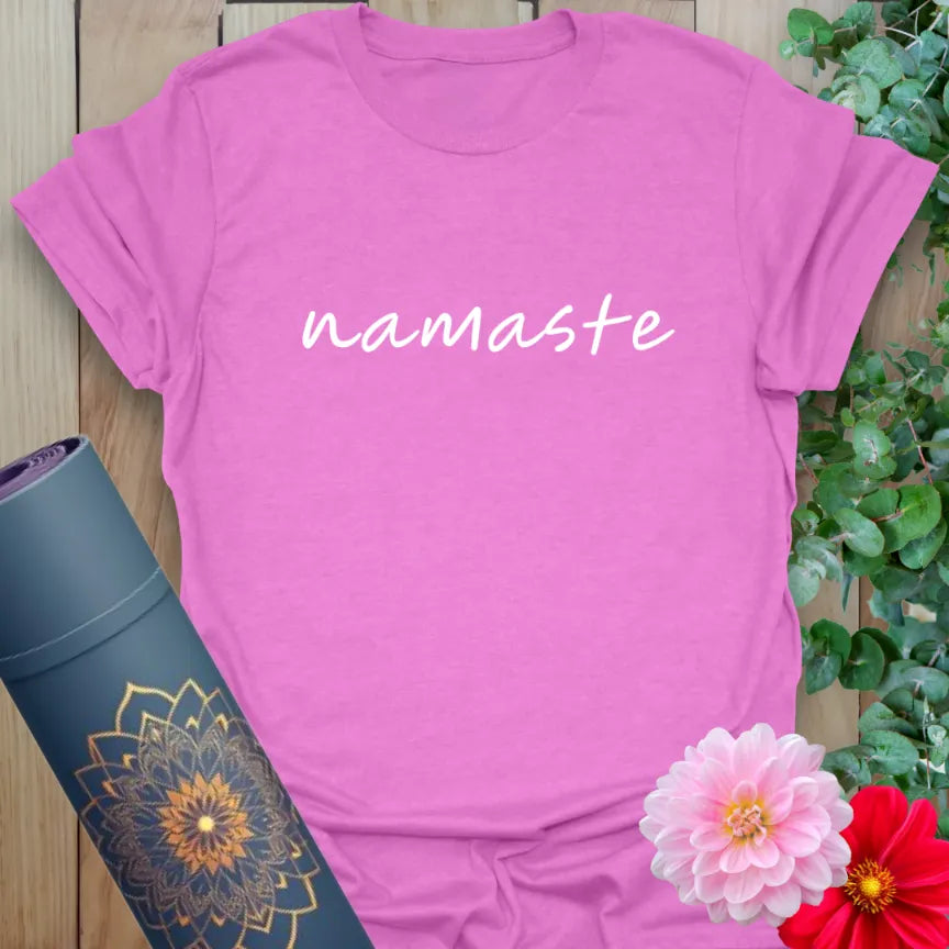 Radiant orchid-colored yoga tee with simple "namaste" script celebrating soulful presence and heart-centered connection.