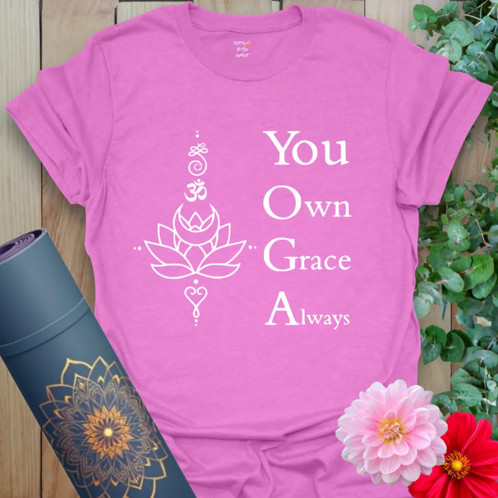 Radiant orchid-colored yoga tee with inspiring "You Own Grace Always" message and sacred artwork for mindful movement.