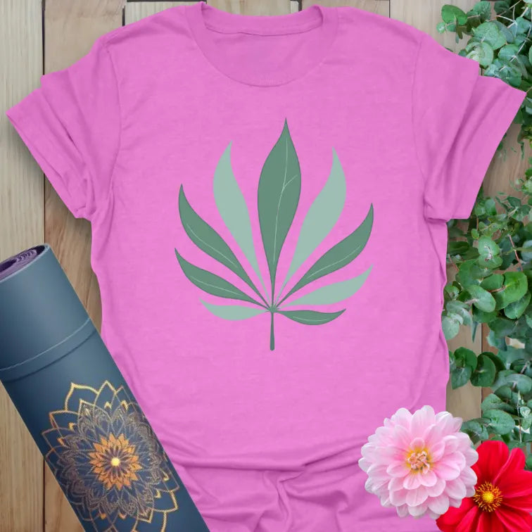 Radiant orchid-colored yoga tee with graceful palm leaf design celebrating mindful expansion and nature’s harmony.