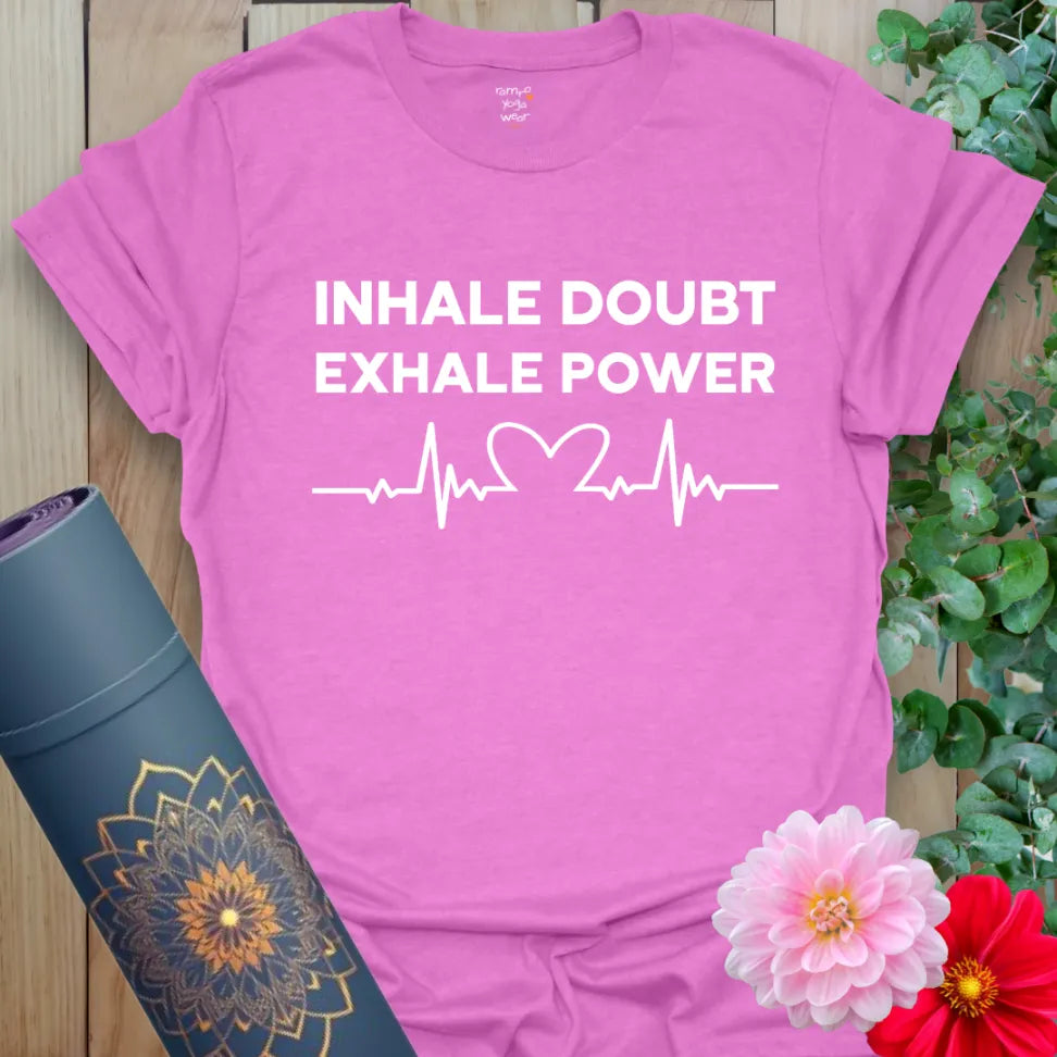 Radiant orchid-colored yoga tee with empowering "Inhale Doubt Exhale Power" quote promoting confidence and mindful resilience.