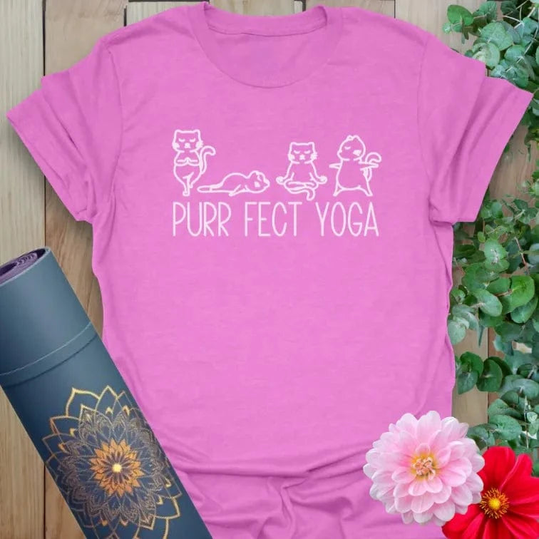 Radiant orchid-colored yoga tee with playful cat illustrations and "Purr Fect Yoga" design celebrating conscious, lighthearted living.