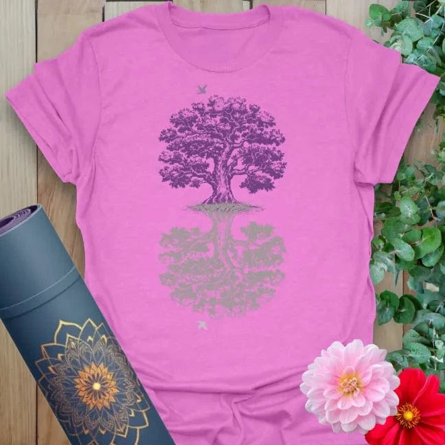 Radiant orchid-colored yoga tee with mystical mirrored tree artwork celebrating balance, reflection, and soulful strength.