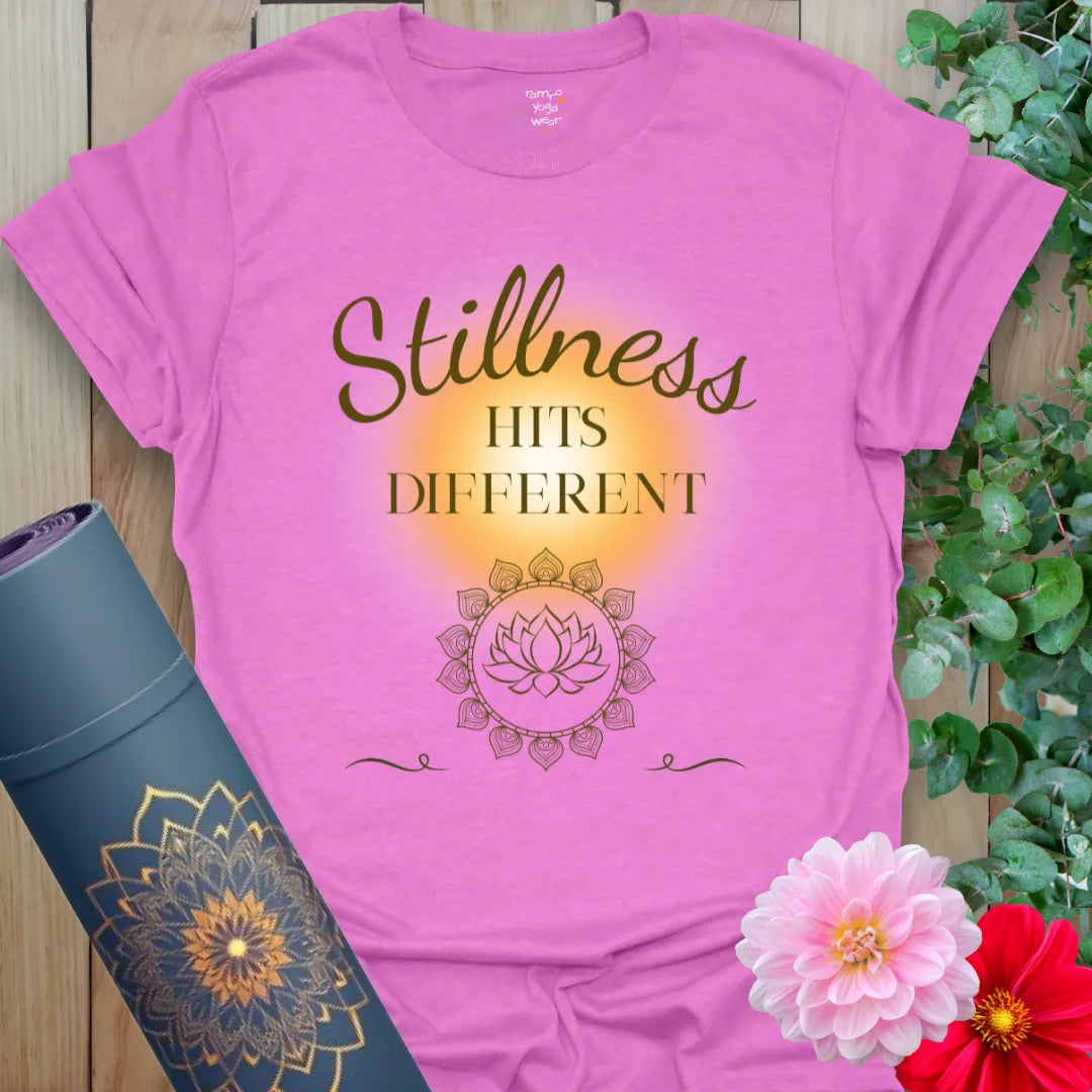 Stillness Hits T-Shirt in Heather Radiant Orchid with glowing yellow aura and delicate lotus detail. A soft yoga gift tee with style and spirit.