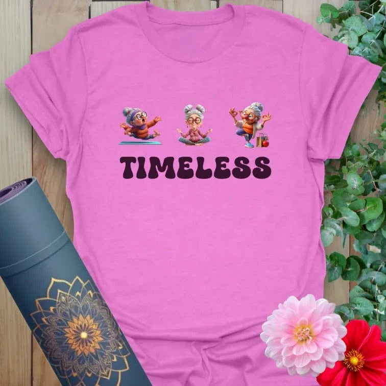 Radiant orchid-colored yoga tee with empowering animated elder design and “TIMELESS” quote for ageless confidence.