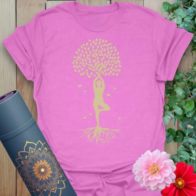 Radiant orchid-colored tee with golden yoga silhouette and blooming tree design for soulful, centered living.