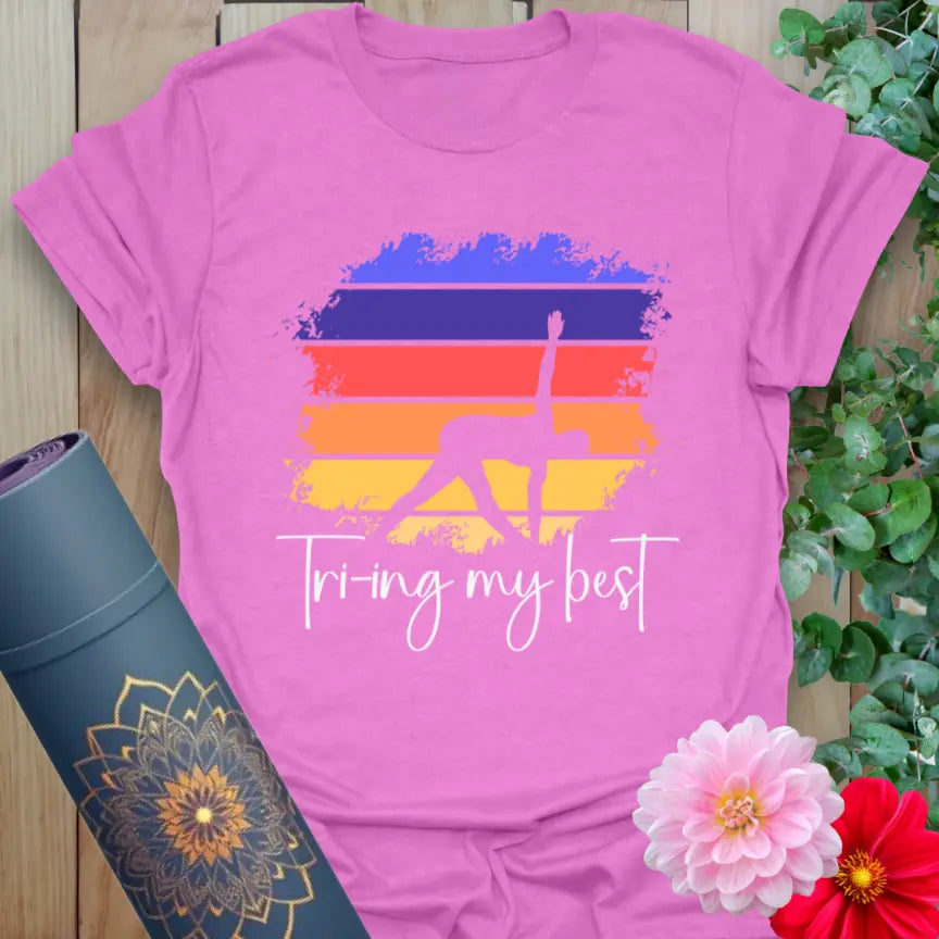 Radiant orchid-colored tee with colorful yoga artwork and “Trying My Best” phrase for soulful, honest wear.