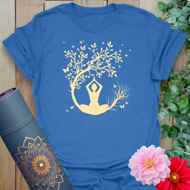 Soft cotton unisex yoga t-shirt with yogi seated beneath a crescent moon and blossoming tree for peaceful living.