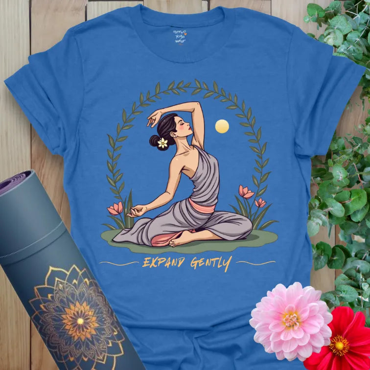 Soft cotton unisex yoga t-shirt featuring serene yogi heart-opener pose with floral and sun design for mindful growth.