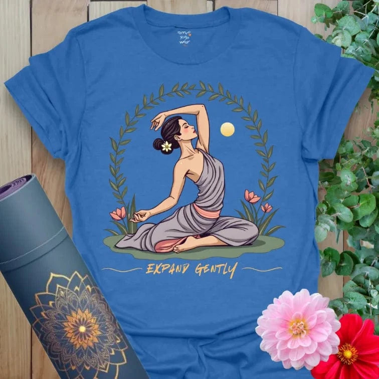 Soft cotton unisex yoga t-shirt featuring serene yogi heart-opener pose with floral and sun design for mindful growth.