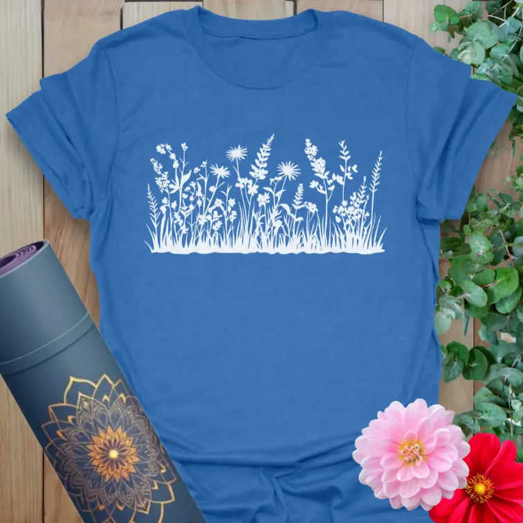 Soft cotton unisex yoga t-shirt featuring delicate wildflower and grass design symbolizing freedom and mindful living.