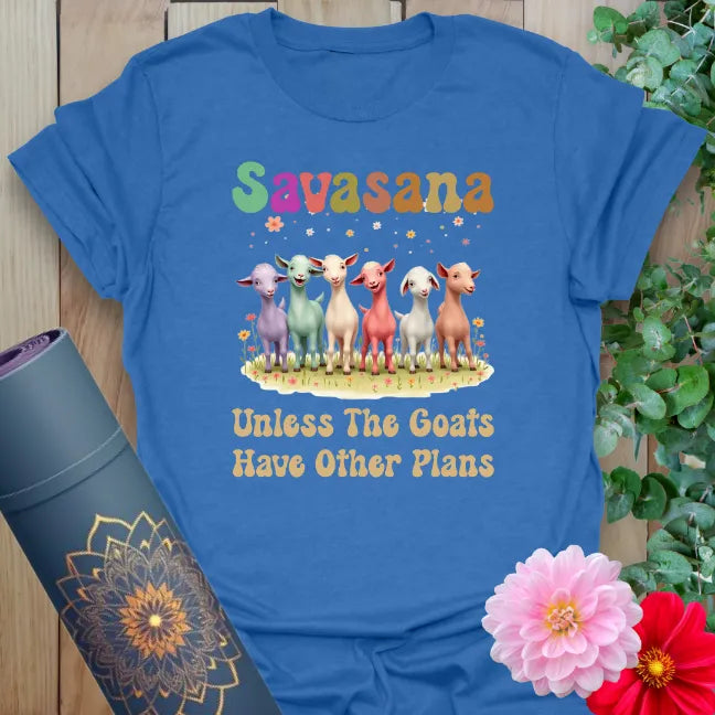 Soft cotton unisex yoga t-shirt featuring colorful goats and "Savasana... Unless The Goats Have Other Plans" humorous quote for playful mindful living.