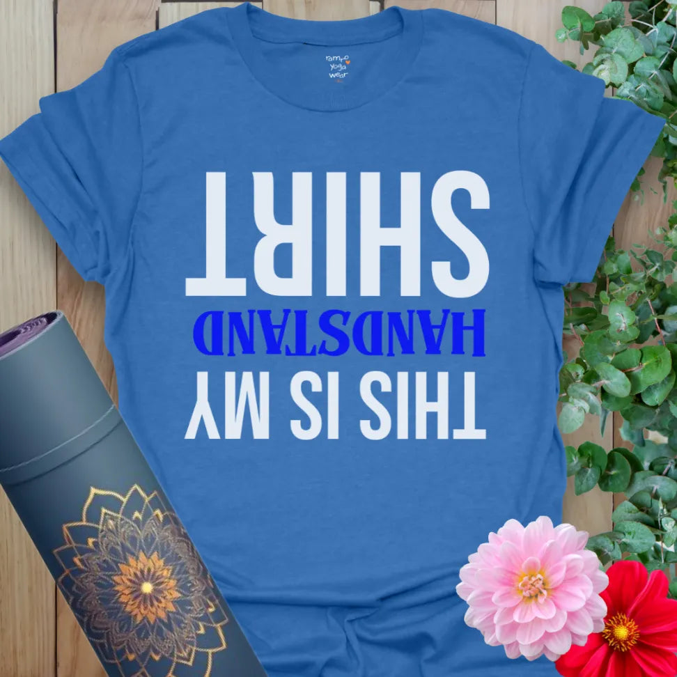 Soft cotton unisex yoga t-shirt featuring playful upside-down "This Is My Handstand Shirt" graphic for joyful mindful movement.