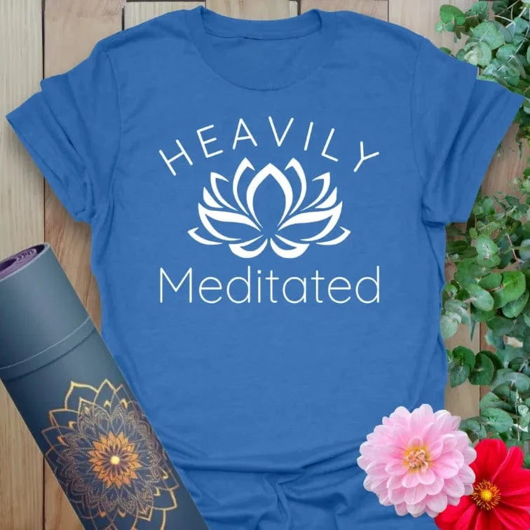 Soft cotton unisex yoga t-shirt featuring playful "Heavily Meditated" quote with lotus flower for mindful, soulful living.
