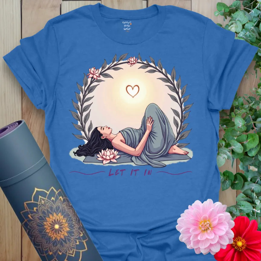 Soft cotton unisex yoga t-shirt featuring heart-opening yogi pose with glowing sunrise and peace wreath symbolizing healing and soulful living.