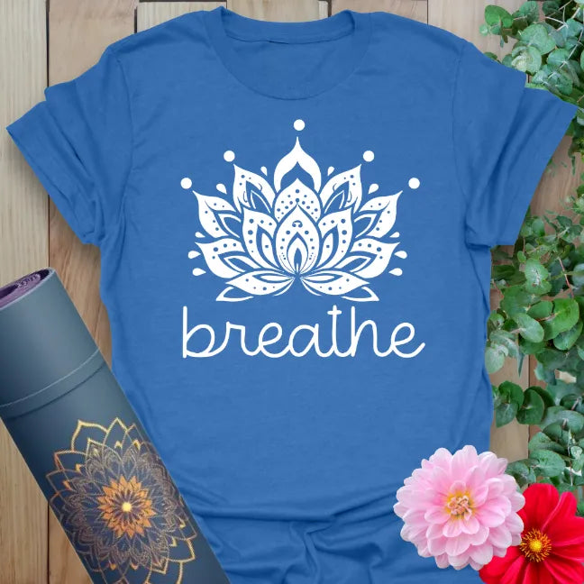 Soft cotton unisex yoga t-shirt featuring intricate white lotus flower and "breathe" text for mindful living.