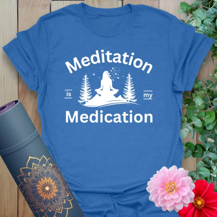Soft cotton unisex yoga t-shirt featuring meditating yogi between trees and "Meditation is my Medication" quote for soulful, healing living.