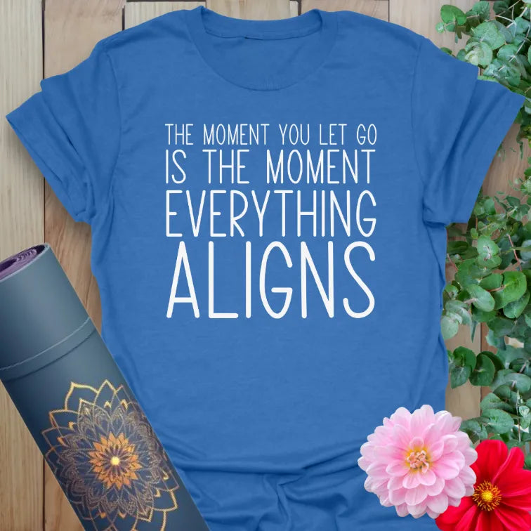 Soft cotton unisex yoga t-shirt featuring "The moment you let go is the moment everything aligns" inspirational quote for soulful, mindful living.