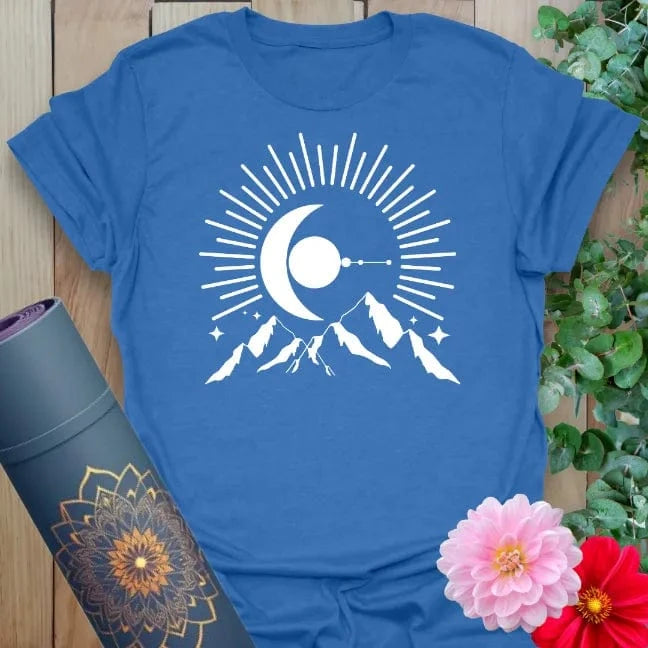 Soft cotton unisex yoga t-shirt featuring crescent moon rising over mountain peaks with radiant beams symbolizing cosmic beginnings and soulful adventure.